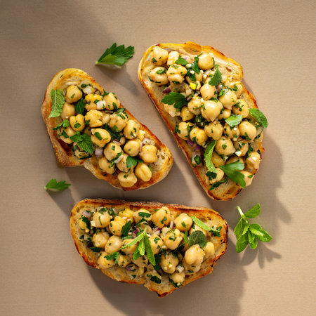 Healthy bruschetta with chickpeas, red onion and herbsの写真素材