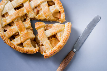 Popular American apple pie on gray table background. Homemade classical fruit tartの写真素材