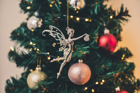Decorated Christmas tree with holiday ornaments. Beautiful Christmas ballerina toyの写真素材