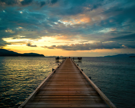 A wooden pier that stretches out to the sea,seascape view sunset