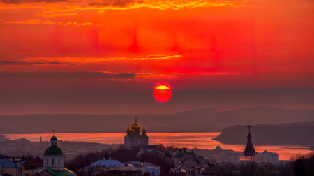 Stunning sunrise over cityscape with churchesの写真素材