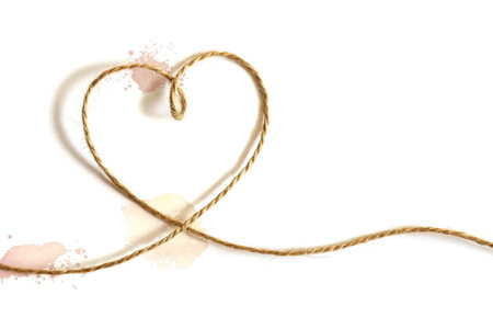 A rustic twine forms a heart shape against a clean white background. Subtle watercolor splatters in...