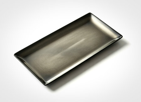 A single, empty rectangular ceramic dish with a unique gradient of dark grey to lighter metallic...