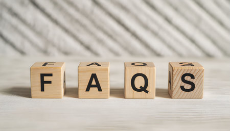 The image shows the word 'faqs' spelled out with wooden blocks on a wooden surface.