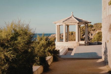 A historical Greek temple with tall columns and stone stairs outdoors