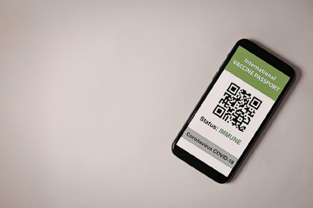 a smartphone displaying a qr code on its screen with a green and white interface