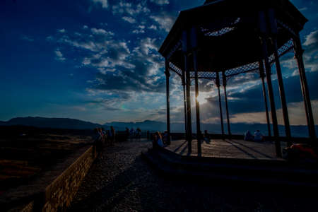 On purpose underexposed view of a gazebo in Ronda, Spain during a sunset.の写真素材