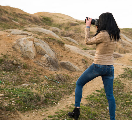 Girl photograper shooting landscapeの写真素材