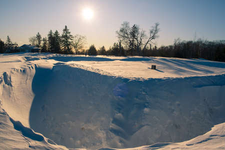 Sunset on snowy landscape in Quebec, Canadaの写真素材