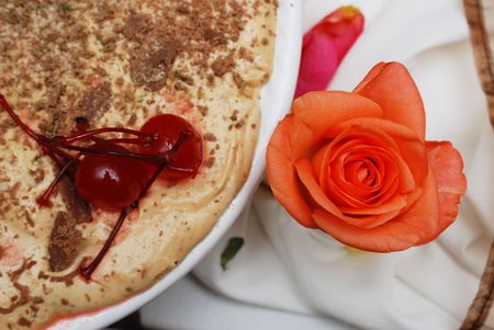 Traditional South African peppermint crisp tart, decorated with cherries and a rose.の写真素材
