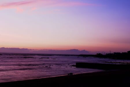 Landscape of the ocean at sunset in Gordon's Bay, South Africaの写真素材