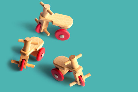 Tricycle wooden toy on oceanic color background with clipping path.
