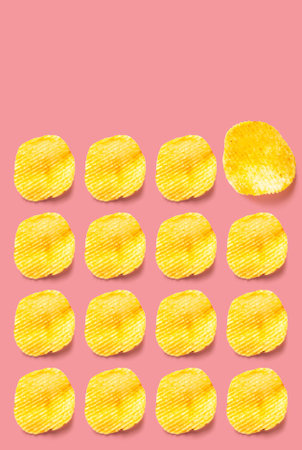 Potato chips pattern on pastel pink background top view with clipping path.の写真素材