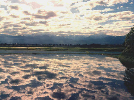 Cloudy sky and water reflection