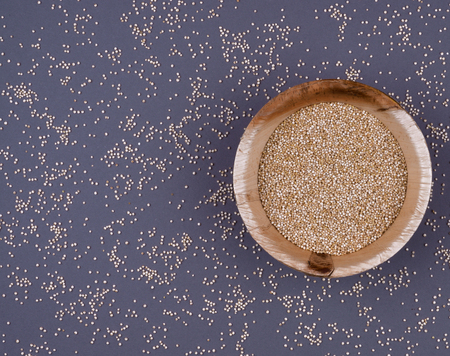 Quinoa in bowl on the dark background. Flat lay style. Diet and healthy food concept.の写真素材