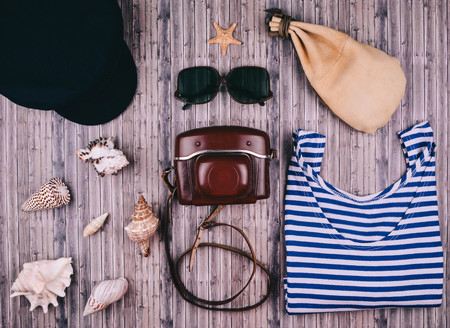 Summer holiday background, travel concept with vintage camera on wooden table background. Flat lay style.の写真素材