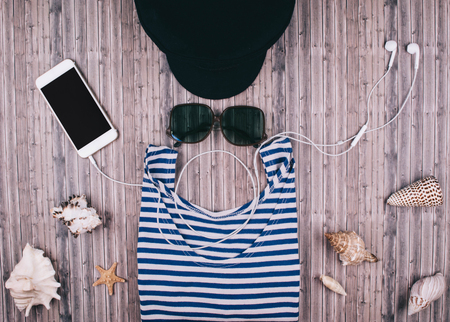 Summer holiday background, travel concept with vintage camera on wooden table background. Flat lay style.の写真素材