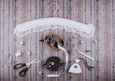 Background with stylish sewing tools and accessories on wooden table.の写真素材