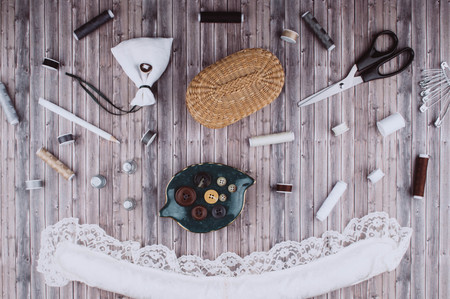 Background with stylish sewing tools and accessories on wooden table.の写真素材
