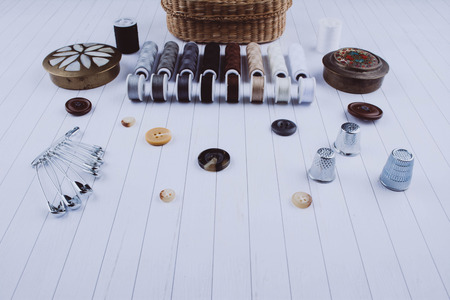 Background with stylish sewing tools and accessories on wooden table.の写真素材