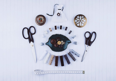 Background with stylish sewing tools and accessories on wooden table.の写真素材