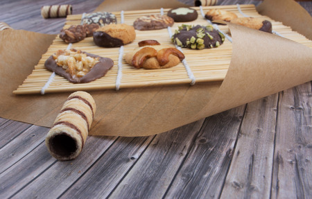 Dark vintage background with various homemade cookies. Healthy eating and cooking concept. Top view. Rustic style.の写真素材