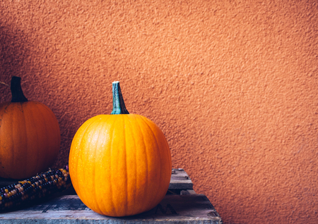 A rustic autumn still life with organic pumpkins in the hay.の写真素材