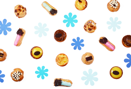 Delicious various pastries isolated on white background. Flat lay style.