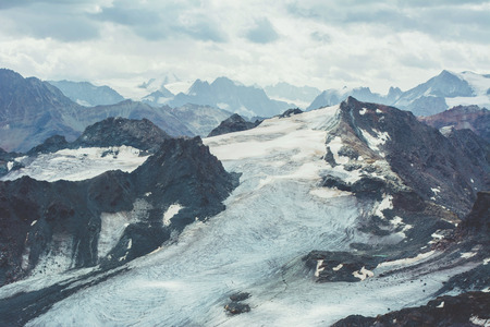 View of beautiful landscape in the Alps with snow-capped mountain tops.の写真素材