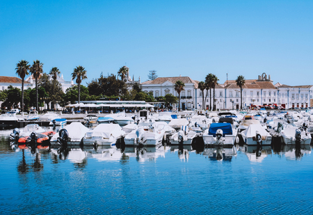 Boats at the marina of Faro with clear blue sky Algarve, Portugal.
