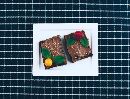Cup of coffee with homemade vegan cake brownies. Flat lay styleの写真素材