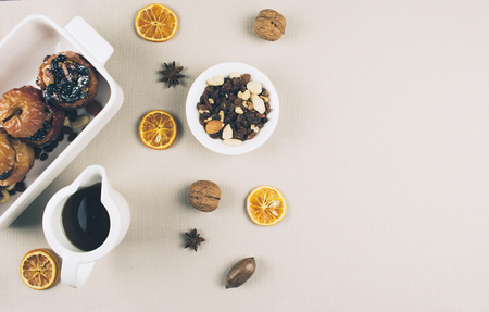 Baked apples stuffed with dried fruit nuts. Flat lay style.の写真素材