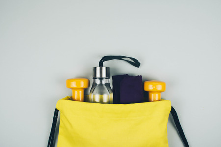 Creative flat lay of sport and fitness equipments with copy space.