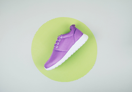 Creative flat lay of sneaker on gray background with copy space.の写真素材