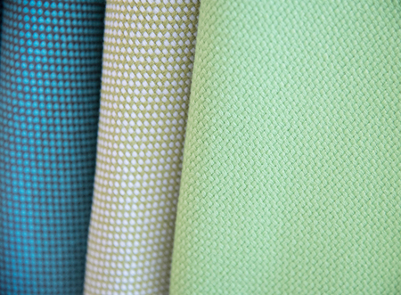 Multi color fabric texture samples as a background.