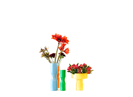 Beautiful colorful vases with different flowers on white background.の写真素材