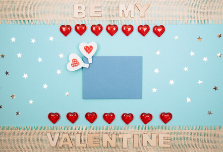 Red heart against blue background. Valentine s day theme with copy space.の写真素材