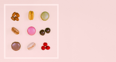 Colorful macaroons on the pastel pink background.の写真素材
