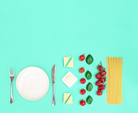 Italian pasta with tomatoes, grated parmesan and basil.の写真素材