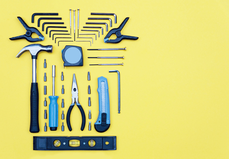 Set of tools. Home improvement concept on yellow background.の写真素材