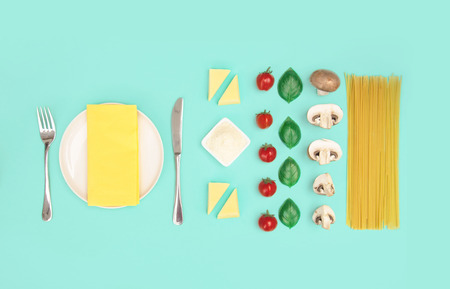 Italian pasta with tomatoes, grated parmesan and basil.の写真素材