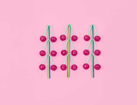 Assorted colored candies on pink background.の写真素材