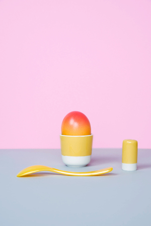 Easter egg on pastel background. Creative easter concept, minimal style.