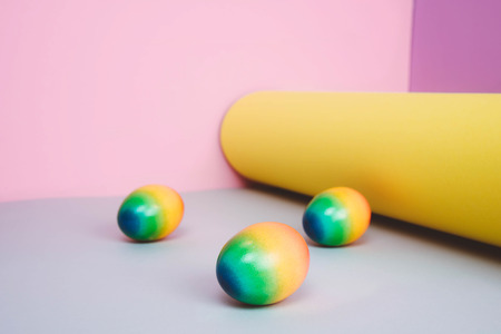 Easter eggs on pastel background. Creative easter concept, minimal style.の写真素材