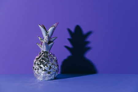 Tropical golden Pineapple on ultraviolet background.の写真素材