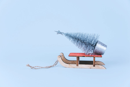 Stylish vintage wooden sled on bright background.の写真素材