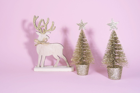 Christmas wooden tree with reindeer over light blue background. Xmas and holiday concept.の写真素材