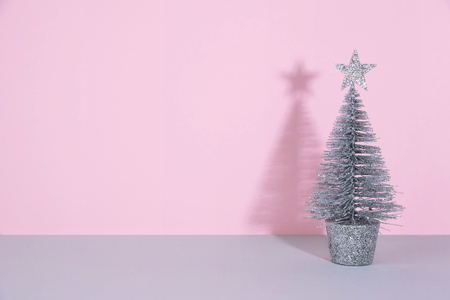 Christmas tree over light blue background. Xmas and holiday concept.の写真素材