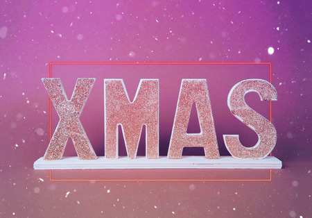 Wooden XMAS inscription with neon frame and snowflakes.の写真素材