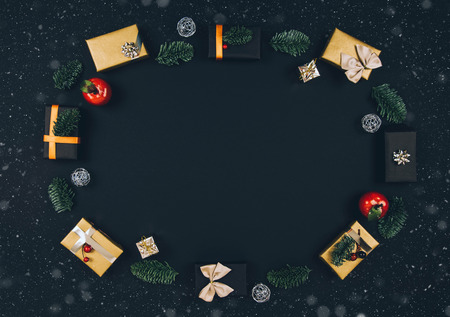 Christmas new year black stylish background and frame with gifts. Top view.の写真素材